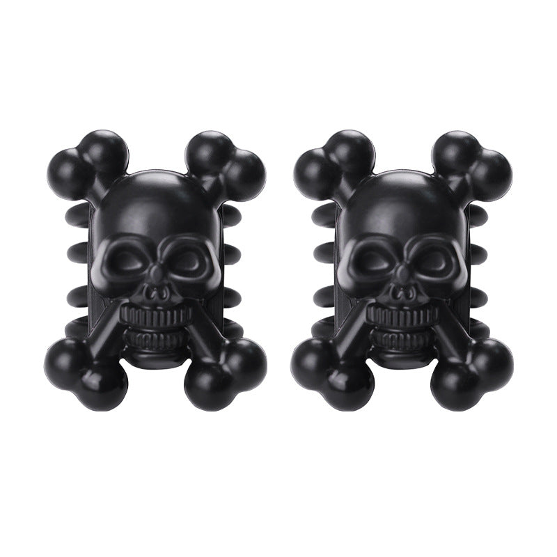 Pair of black rubber skull limb dampeners for compound bow vibration and noise reduction